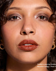 Model wearing Glowify Long-Lasting Eyeshadow Stick product shade Roasted Coffee.