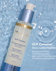 SeneGence GLP Complex serum bottle with pump on a blue water background