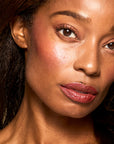 Model with Bouncy Mousse Multi-Use Pigment product shade Berry Whip.
