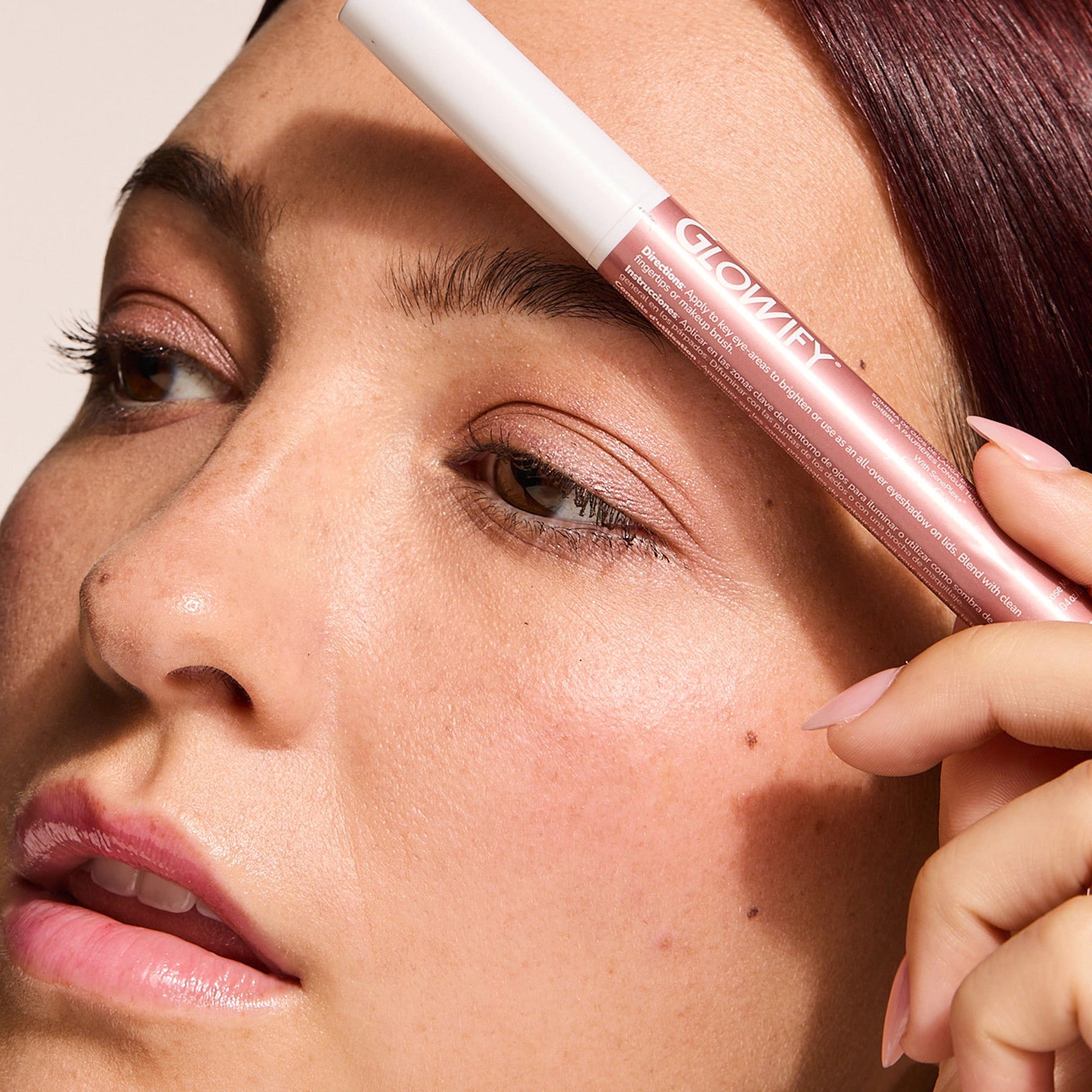 Model wearing Glowify Long-Lasting Eyeshadow Stick product shade Rose Mauve.