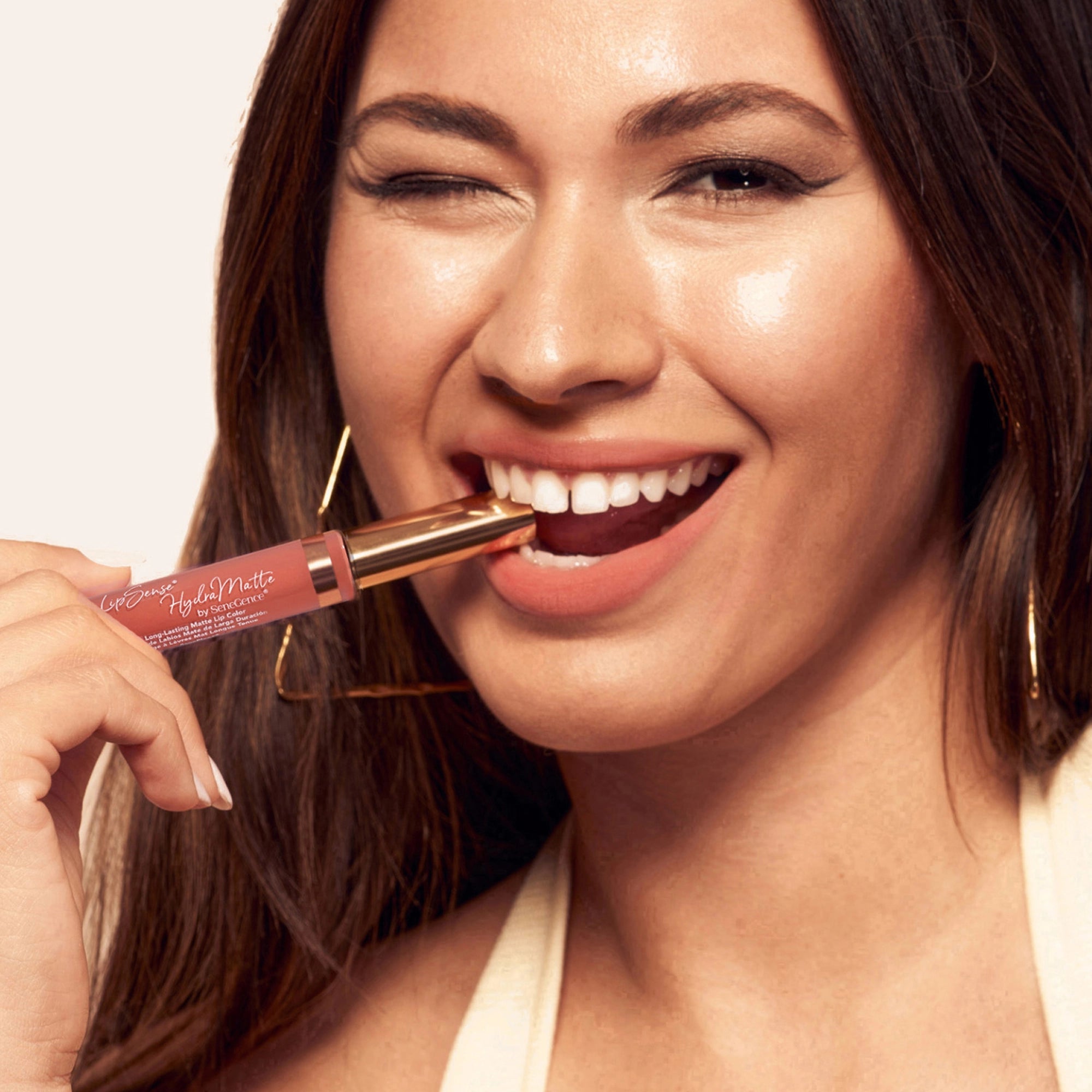 Model wearing LipSense Cream product shade Apricot Angel.