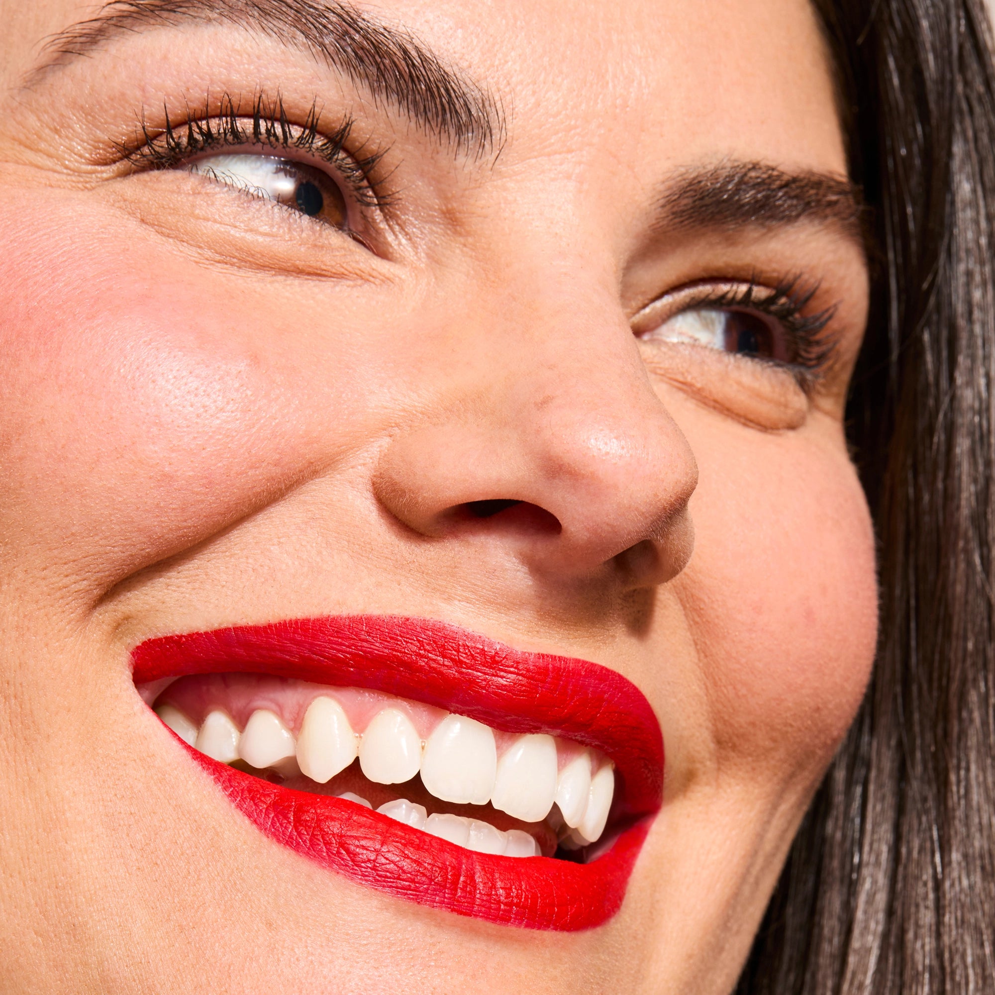 Model wearing LipSense Cream product shade Blu-Red.