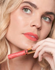 Model wearing LipSense Cream product shade Candy Coral.