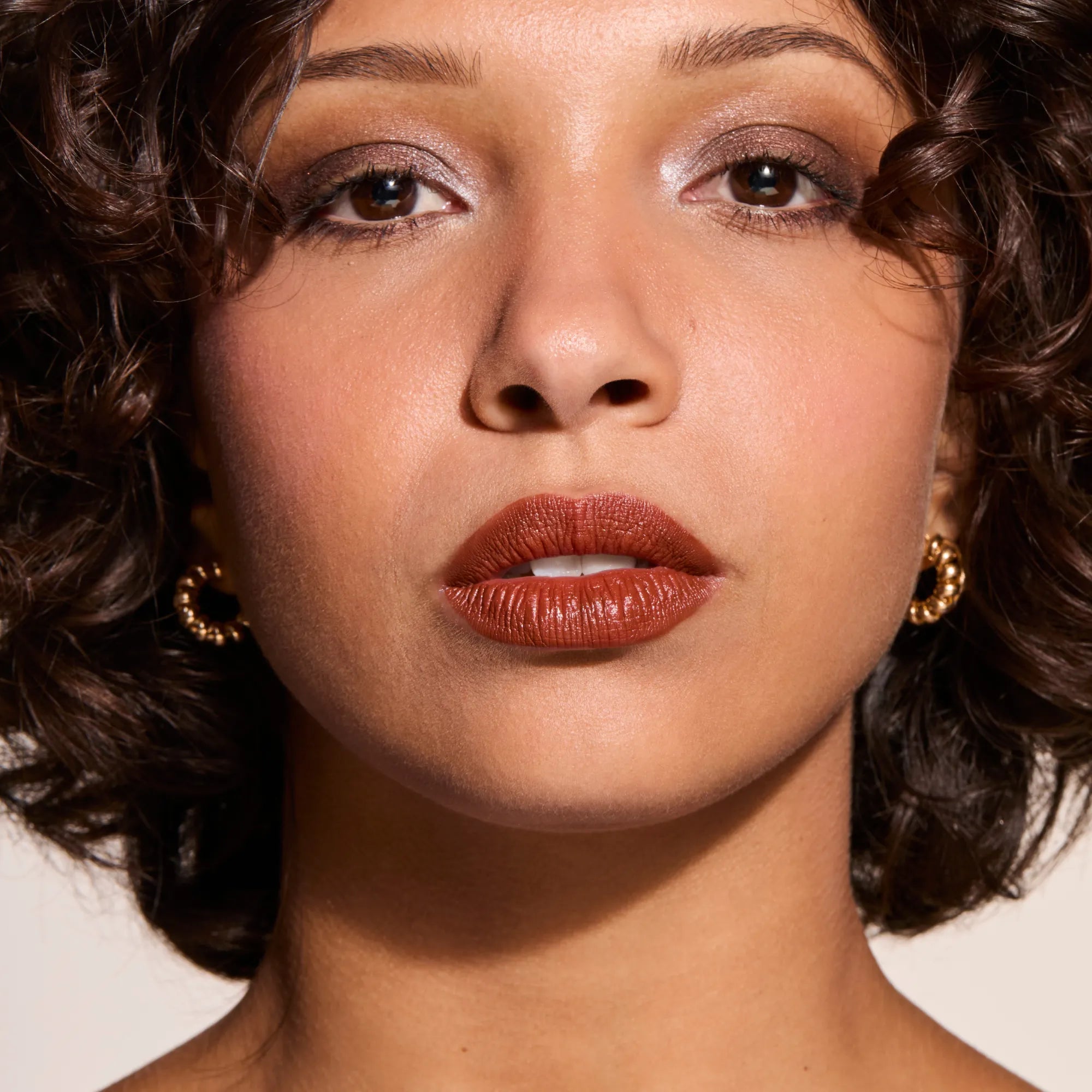 Model wearing LipSense Cream product shade Chocolate Bar.