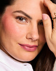 Model wearing LipSense Cream product shade On Pointe Pink.