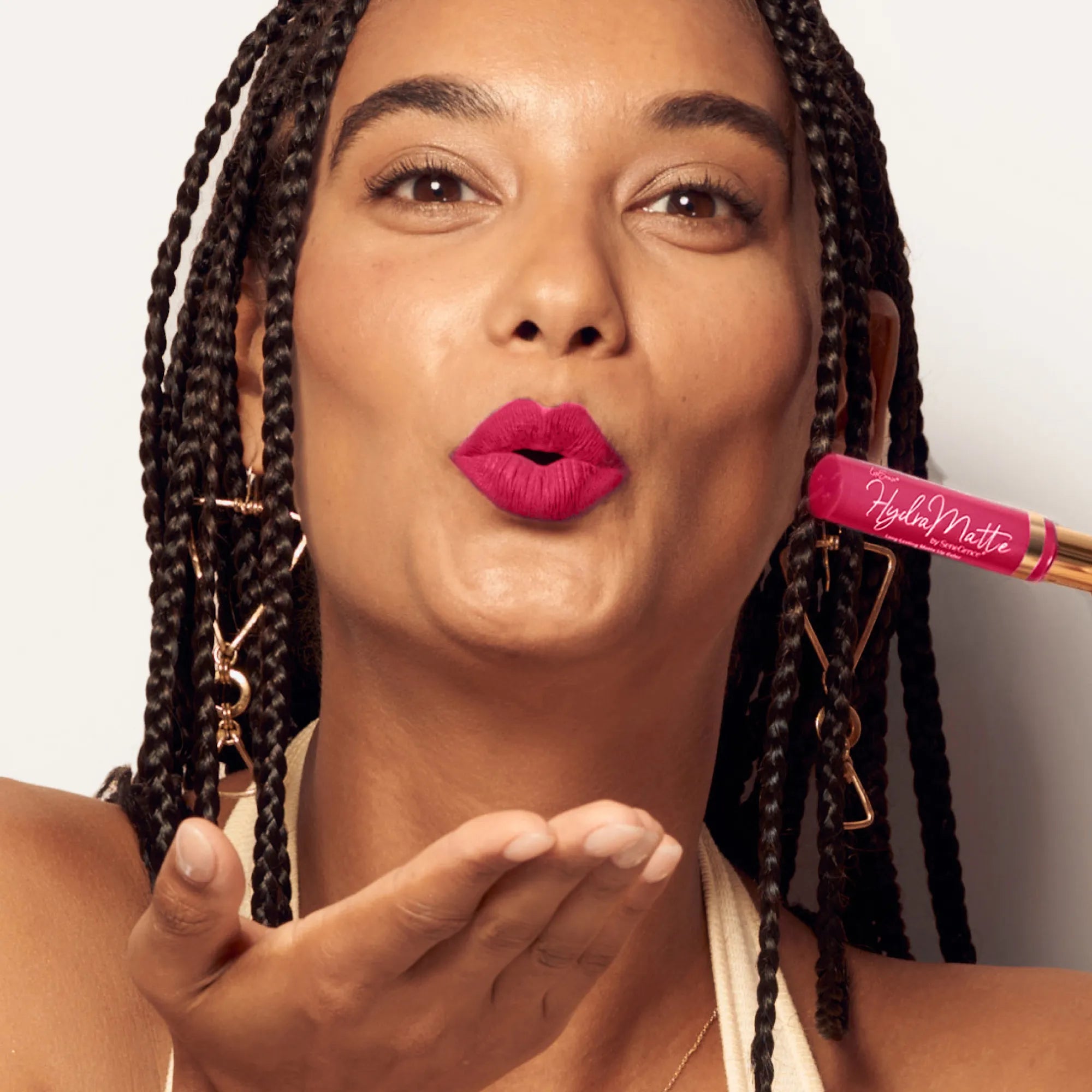 Model wearing LipSense Cream product shade Peony Pink.