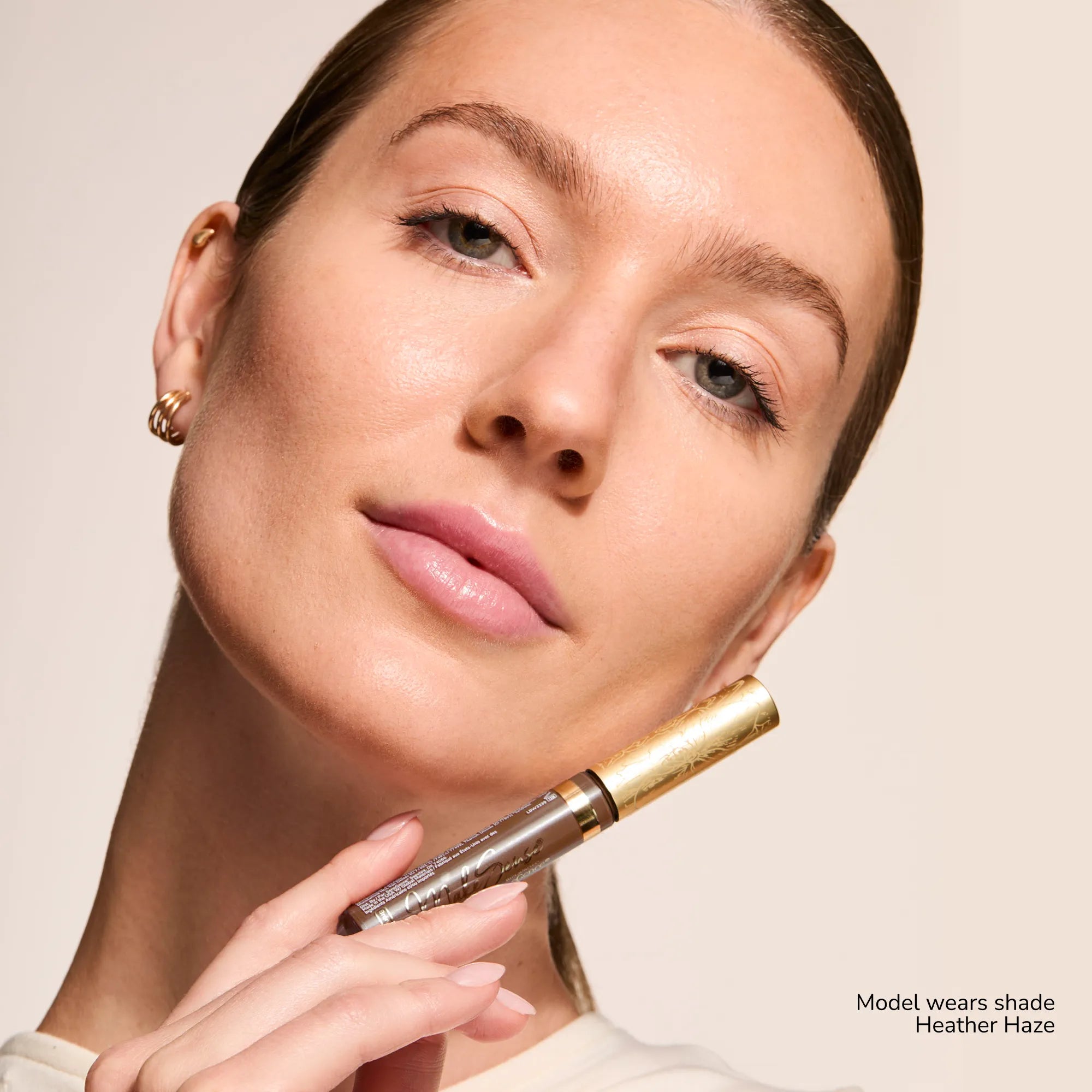 Model wearing Contouring Bronzer Cream product shade Heather Haze