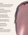 Creamy shimmery pink swatch on beige background with Vitamin E skincare ingredient list.