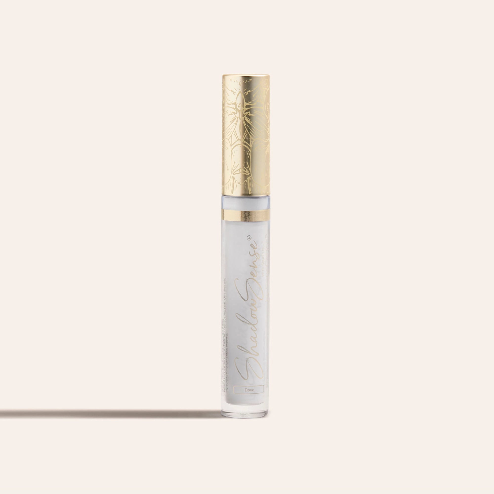 ShadowSense Eyeshadow NZL in a slender clear tube with pale lavender shimmer and a decorative gold cap
