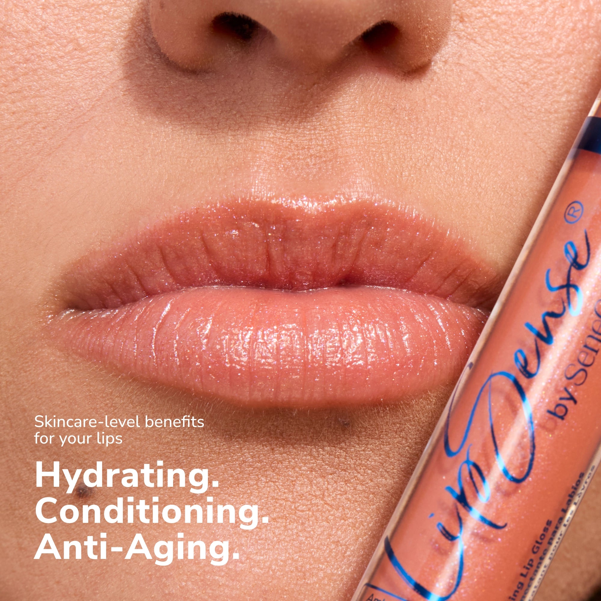 Close up of glossy lips with a LipSense gloss tube beside them showing a peachy shade